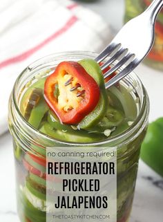 a jar filled with pickled jalapenos and a fork stuck in it