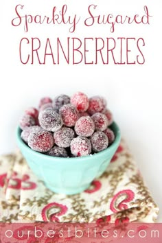 a blue bowl filled with sprinkled cranberries on top of a table