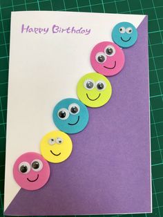 a happy birthday card with buttons and eyes