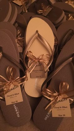 several pairs of sandals with ribbons tied around them