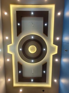 an overhead view of a ceiling with lights in the center and a clock on it