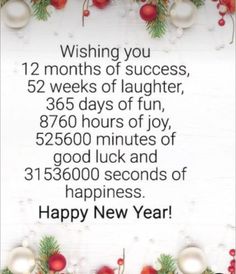 a happy new year message with christmas decorations and baubles on the table,