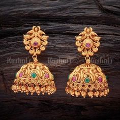 Designer antique jhumka earrings studded with synthetic ruby green stones, plated with gold polish and made of copper alloy #antique #jhumka #earrings #jewellery #kushalsfashionjewellery Jimikki Kammal Gold Design, Buttalu Earrings Gold, Earrings Diamond Studs, Antique Jhumka, Gold Ideas, Necklaces Simple, Gold Earrings Indian, Trendy Jewerly