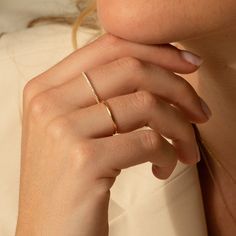 Meet the perfect dainty diamond band ring - the Pavé Diamond Ring. Studded in tiny diamonds, its classic design and dainty size make it the perfect everyday ring. It’s lightweight and solid gold, so it’s sure to give you a confidence boost and a little sparkle as you take on your day. Make it yours and treasure this classic forever! DETAILS 14k solid gold ring 24 lab-grown diamonds Diamond carat: 0.01 ct Diamond color & clarity: DEF-SI Available in sizes 5-8 Weight: 0.63g Safe for sensitive skin Single Rings Simple, Dainty Silver Jewelry Rings, Gold Ring Dainty, Rings On Short Fingers, Minimal Ring Design, Gold Rings Dainty, Simple Gold Rings Everyday, Everyday Ring Stack, Rings Gold Simple