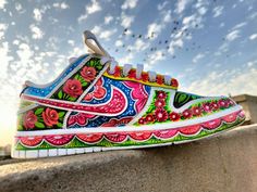 Pakistan truck art shoes  Introducing our exquisite handmade truck art shoes for women, a stunning fusion of Pakistani tradition and contemporary fashion. These one-of-a-kind shoes are meticulously crafted with utmost care and attention to detail, bringing the vibrant spirit of Pakistan's truck art to your feet. Each pair of shoes is a true work of art, featuring intricate hand-painted designs inspired by the lively and colorful motifs found on Pakistani trucks. From swirling patterns and intricate florals to eye-catching geometric shapes, every brushstroke tells a story and captures the essence of Pakistani culture. These handmade truck art shoes make a perfect gift for the style-conscious woman who appreciates artistry and seeks to embrace diverse cultures. Each pair is a symbol of creat Hand Painted Multicolor Sneakers For Summer, Artistic Multicolor Sneakers For Summer, Artistic Hand Painted Multicolor Custom Sneakers, Artistic Multicolor Summer Sneakers, Artistic Hand-painted Multicolor Custom Sneakers, Artsy Hand Painted Multicolor Sneakers, Artistic Multicolor Spring Sneakers, Artistic Hand Painted Custom Sneakers For Spring, Truck Art Motifs