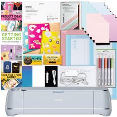 the cricut machine is surrounded by many different types of paper and stationery