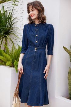 This band collar denim mermaid dress features a sophisticated half-sleeve design that exudes elegance. The cropped sleeves and flared slip bottom add a touch of luxury, making this blue denim dress a must-have for any fashion-forward individual. Elevate your wardrobe with this exclusive and tasteful piece. Cropped sleeves Band collar Front chest buttons Ruffle split bottom Cotton, polyester, spandex Machine wash, tumble dry Item #4101721 Women's denim dress SIZE INFO XS=US2=UK6=EU32 S=US4-6=UK8-10=EU34-36 M=US8-10=UK12-14=EU38-40 ★★Please advise your Height and Weight, I will make sure you choose the right size. Vestidos Retro, Blue Denim Dress, Spring Dresses Casual, Womens Denim Dress, Cropped Sleeves, Fishtail Dress, Spring Wear, Ruffle Midi Dress, Dress Retro