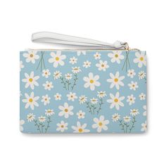 Introducing the Sky Blue Daisy Clutch Bag, a sweet and charming accessory perfect for adding a touch of calm to any outfit. The light blue color and delicate daisy print exude an adorable and pretty vibe, while the addition of white flowers adds a floral touch. Carry this bag to elevate any look with its calming and cute design. Designed with a loop handle to quickly free your hands, this fabulous clutch bag is made for anyone on the go. It can hold everyday essentials such as a phone, wallet, and keys. Carry your lipstick or makeup in here too! It features a zip fastening and a fully lined internal pocket. It is made of vegan leather in the Saffiano pattern finish that was invented by Prada. .: Material: 100% PU faux leather .: One size: 9.5" x 6.6" (24 x 17 cm).: Wrist strap.: Saffiano p Trendy Blue Floral Print Bags, Cute Blue Bag For Spring, Cute Blue Spring Bag, Cute Light Blue Bag For Gift, Bottle Garden, Blue Daisy, Daisy Print, Dress Jewelry, Light Blue Color