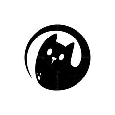 a black and white image of a cat in a circle with its head inside it