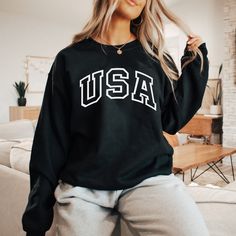 Celebrate America with this patriotic USA Sweatshirt! Perfect for the 4th of July or any day, show off your love for the country and your playful spirit. Made with quality materials for a comfortable fit. Usa Sweater, Usa Sweatshirt, Black Media, Black Sweaters, 4th Of July, White And Black, Comfort Fit, Black And White, Celebrities