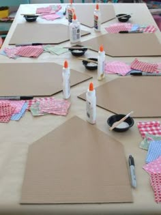 several pieces of craft paper laid out on a table