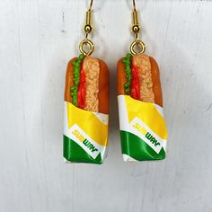 These adorable  sub earrings feed anyones hunger for fashion. Each sub dangles from a hypoallergenic hook earring. Each sub is approximately 1 1/4 inch tall by 1/2 inch wide  Please note these are not real food and they do have a little weight to them Silly Earrings, Crazy Earrings, Weird Earrings, Tuna Sandwich, Weird Jewelry, Book Earrings, Miniature Food Jewelry, Quirky Earrings, Food Earrings