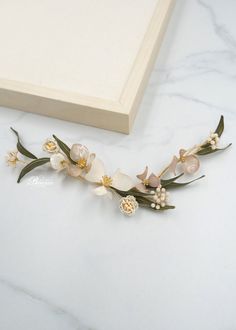 This bridal hair vine is perfect for rustic wedding. DETAILS: Embellish your bridal up-do with this romantic and feminine floral hair clip. Our delicate and ethereal Layla bridal hair accessory features nature inspired green leaves accented with delicate hand made white and pale pink flowers.  Hairpiece include 2 elements which you can arrange in a different way, depending  on your hairstyle. Can be attached on pins to the wire loops on each end for a different look. This botanical beauty is per Bridal Flower Hair Comb, Flower Hairpiece, Clip Wedding Hair, Floral Bridal Hair, Hair Clip Wedding, Bridal Floral Headpiece, Flower Hair Accessories Wedding, Wedding Hair Head Piece, Gold Earrings Wedding