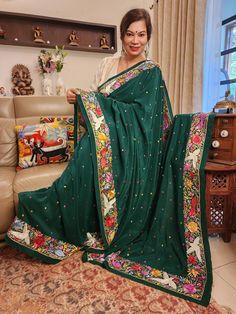 Update! - Zynah covered by LBB - https://lbb.in/bangalore/zynah-designs-handloom-sarees/ Introducing our Green Pure Crepe Silk Hand Embroidered Parsi Gara Saree, a stunning masterpiece that is sure to captivate your heart. Adorned with intricate Parsi Gara embroidery, this saree features a beautiful combination of border and all-over multi-color polkas that add a playful and cheerful vibe to the overall design. The pure crepe silk material lends a luxurious feel to the saree, making it perfect for special occasions. Drape it around yourself and feel the exquisite craftsmanship and attention to detail that has gone into creating this beauty. Let this authentic vintage art saree /heirloom piece bring out the diva in you and leave everyone in awe. This is a completed hand-made saree and usual Green Raw Silk Traditional Wear With Floral Embroidery, Green Floral Embroidered Raw Silk Traditional Wear, Green Shawl With Resham Embroidery In Traditional Drape, Traditional Embroidered Green Shawl, Green Silk Blouse Piece With Embroidered Border, Traditional Green Saree With Floral Embroidery, Green Traditional Dupatta With Floral Embroidery, Traditional Green Dupatta With Floral Embroidery, Green Bohemian Dupatta With Floral Embroidery