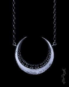 In honour of Artemis, Goddess of the wilds and Goddess of the moon. She who wears the crescent moon crown. This necklace features a faceted crescent moon lined with a row of 13 gemstones. Each of the gemstones are meticulously set by hand, with each claw that secures the gemstones being painstakingly, individually handcrafted. The surface of the crescent moon is uniquely textured with lunar craters and crosshatched markings that give it the appearance of an ancient relic. The necklace is produced entirely in sterling silver which is treated with a dark patina then brightly polished to highlight the depth of all the intricate details.  -GEMSTONES- The Artemis necklace comes in three gemstone options: Black Spinel- Deliciously dark and glossy, completely opaque and void of colour Moonstone- Artemis Necklace, Moon Crown, Artemis Goddess, Goddess Of The Moon, The Wilds, Bone Jewelry, Dark Style, True North, Dark Gothic