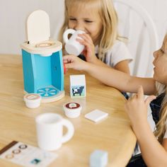 Pretend-play tea parties can now include coffee with this realistic wooden Brew & Serve Coffee Set for two! Lift the lid and pop in one of three coffee pods (regular, hazelnut, or mocha) and turn the knob to choose the serving size! Too hot for coffee? Add the included wooden ice cube to make it “iced.” The 11-piece set comes with two wooden mugs, creamer, sugar, a spoon, and even a re-usable order card for budding baristas! Quality construction means endless hours of imaginative play! Makes a g Wooden Mugs, Realistic Play Food, Play Kitchen Accessories, Pretend Play Food, Pretend Play Kitchen, Melissa And Doug, Pretend Play Toys, Melissa & Doug, Beach Toys