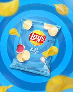 lays potato chips are flying in the air on a blue background with yellow and red swirls