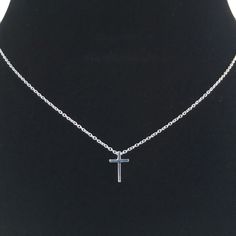 This tiny silver cross necklace is a classic addition to your layering necklaces. This minimalist necklace is also perfect by itself. The cross charm is sterling silver and measures approximately 12 mm in length or 1/2 inch. The chain is delicate looking but sturdy sterling silver. This dainty cross necklace is available in lengths from 15 - 18 inches. You may choose to add an attached extender. Your new necklace will come in a box, ready for gift giving. More Christian jewelry https://www.etsy. Minimalist Clavicle Chain Necklace With Cross Pendant, Minimalist Clavicle Cross Chain Jewelry, Silver Cross Necklace With Clavicle Chain, Dainty Cross Pendant Charm Necklace With Clavicle Chain, Dainty Charm Necklace With Clavicle Chain And Cross Pendant, Silver Cross Pendant Necklace For Everyday, Silver Necklace With Delicate Chain And Cross Pendant, Minimalist Cross Necklace For Everyday, Dainty Silver Crucifix Necklace