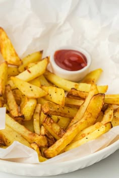 french fries with ketchup in a white bowl