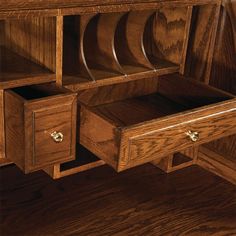 a wooden desk with drawers on top of it