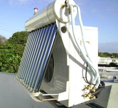 an air conditioner sitting on top of a roof