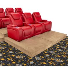 rows of red leather seats sitting on top of a black carpeted area next to a rug