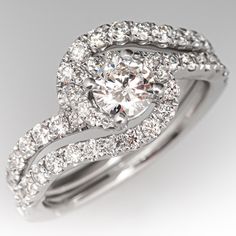 a diamond ring with two rows of diamonds on top and bottom, set in 18k white gold