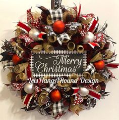 a christmas wreath hanging on the wall next to a sign that reads merry christmas, let's hung around design