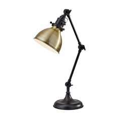 an antique style desk lamp with a black metal base and a gold shade on the arm