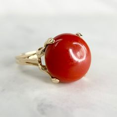 Vintage Red Jasper cabochon ring made from 14K yellow gold. The handmade gallery perfectly complements the vibrant stone, which has no abrasions or scuffs. We like this piece on the ring finger or the pinky. Polished and ready to wear. Hallmarked and tested. Size 7.5 and sizable upon request for an additional price. We are a brick and mortar store located in Alhambra, CA. All of our items are guaranteed as described. SPECIFICATIONS: Size: 7.5 Stone measures: 13mm x 13mm Total Weight: 4.44 grams This ring has been inspected by professionals with over 35 years of experience to ensure its excellent condition. **Please inquire about sizing before purchase or making an offer. Order will ship within 24 hours. We offer a 14-day, no-questions-asked return policy. Please see detailed pictures, as t 14k Gold Dome Ring With Cabochon, Red Cabochon Ruby Ring In 14k Gold, 14k Gold Red Cabochon Ruby Ring, Red Ruby Oval Cabochon Ring In 14k Gold, Oval Cabochon Red Ruby Ring In 14k Gold, Heirloom Red Ruby Cabochon Ring, Heirloom Red Cabochon Ruby Ring, Red Domed Gemstone Rings, Yellow Gold Carnelian Oval Cabochon Ring