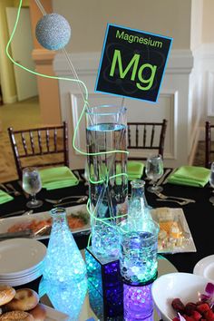 the table is set up for a science themed party