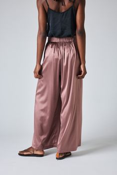 These silk cargo pants are a romantic and luxurious addition to any look. Pair them with the Power Trip Silk Blazer for a fashion-forward evening look, or boss babe work vibe. Wide Leg Silk Pants With Pockets, Luxury Pink Silk Bottoms, Silk Cargo Pants, Silk Wide-leg Bottoms With Elastic Waistband, Luxury Wide-leg Silk Pants, Bohemian Silk Wide-leg Pants, Light Pink Pants, Silk Blazer, Power Trip