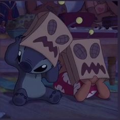 a cartoon character with a box on his head sitting in the middle of a room