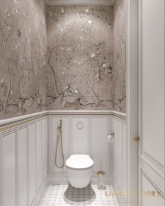 a white toilet sitting inside of a bathroom next to a wall mounted shower head and faucet