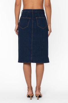 Expertly crafted and versatile, the Moira Skirt is a must-have for any wardrobe. This button-up denim skirt features side and back pockets, as well as belt loops for added convenience. Perfect for any occasion, this utility skirt effortlessly combines style and functionality. Material: 98% Cotton and 2% Elastane Machine wash cold Color: 177 Deep Indigo Model is 5'9"and wearing a size S Imported Cotton Denim Skirt With Belt Loops For Work, Cotton Dark Wash Denim Skirt With Belt Loops, Medium Wash High Waist Skirt With Belt Loops, Denim Blue Cotton Skirt With Belt Loops, High Waist Medium Wash Skirt With Belt Loops, Knee-length Relaxed Denim Skirt With Pockets, Relaxed Knee-length Denim Skirt With Pockets, High Rise Medium Wash Skirt With Belt Loops, High Waist Dark Wash Skirt With Belt Loops