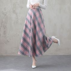 "This winter wool skirt is a classic piece of tailoring that will see you through rain or shine. It is cut with a flattering flared skirt to give you a wonderful shape. The winter skirt is perfect classic styling and ends at the ankle. This is a versatile skirt that you'll wear again and again. DETAILS: * 30% wool, 30% fiber, 40% polyester * fully satiny liner * Two side pockets * Right zip closure * Back elastic, comfortable wear * Plus size full skirt * Ankle length skirt * Perfect for Winter, Pink Midi Skirt For Fall, Pink Fall Midi Skirt, Plaid A-line Skirt With Lining, Long Pink Skirt For Fall, Pink Long Skirt For Fall, Spring Long Wool Skirt, Spring Wool Pleated Skirt, Spring Wool Midi Skirt, Spring A-line Wool Skirt