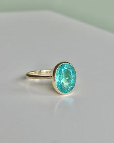 Hand sculpted bezel setting ring with natural earth mined genuine brazilian neon blue lagoon color paraiba apatite. Bezel Setting Ring, Paraiba Tourmaline Ring, Apatite Ring, Bezel Set Ring, Paraiba Tourmaline, Tourmaline Ring, Put A Ring On It, Blue Lagoon, Natural Earth