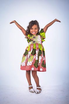 Are you tired of dresses that are nice to look at but just don't seem to provide much use? What about pieces that your little one grows out of before you can make full use of them. Yes, I know that experience too well which is why our Artisans in Nigeria and I created the Elisa design girl dress. Complementary bloomers included for size 12 months and 2T The dress is made out of the softest cotton fabric It has an elastic waist and adjustable ruffled tie on the back that is not only stylish but w Cute Green Dresses For Playtime, Cute Green Dress For Playtime, Cute Green Dresses For Casual Wear, Whimsical Multicolor Short Sleeve Dress, Whimsical Short Sleeve Dresses For Playtime, Green Short Sleeve Dress For Formal Occasions, Playful Green Dress For Dress-up, Green Fun Dresses With Ruffles, Fun Green Short-sleeved Dresses