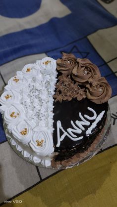 the cake is decorated with chocolate and white frosting