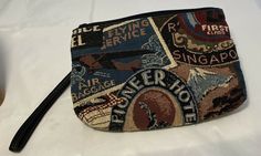 Windsor & York World Hotel Theme Fashion fabric Wristlet Purse Handbag Excellent Condition! Made In The USA Cotton Blend Fabric Lightweight Wristlet Fashionable Design Detachable Strap Top Zip Closure One Inner Zip Pocket Dimensions: 9" Long By 6" High Vintage Travel Clutch Pouch, Retro Travel Clutch Pouch, Vintage Clutch Coin Purse For Travel, Vintage Handheld Clutch For Travel, Vintage Travel Cosmetic Pouch Bag, Vintage Travel Cosmetic Pouch, Vintage Style Cosmetic Travel Pouch, Handheld Zipper Pouch For Travel, Handheld Clutch With Zipper For Travel