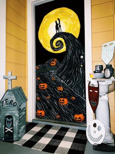 a halloween door decorated with pumpkins and jack - o'- lanterns