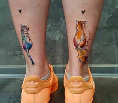 two tattoos on the legs of people who are both wearing orange shoes and one has a cat