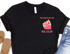 A great customized t-shirt for your nail salon business. A unique, eye catching customized nail salon logo shirt for employees and the owner of the nail salon shop. A great gift for an nail salon owner and/or nail tech.  You've now found the staple t-shirt of your wardrobe. It's made of a thicker, heavier cotton, but it's still soft and comfy. And the double stitching on the neckline and sleeves add more durability to what is sure to be a favorite! * 100% ring-spun cotton * Sport Grey is 90% rin Nail Shop Logo, Nail Salon Logo, Salon Uniform, Salon Owner, Nail Repair, Salon Business, Uniform Shirts, Tech Shirt, Logo Shirt