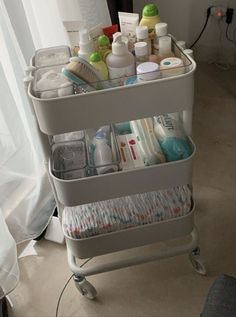 a cart filled with lots of different types of personal care products on top of a floor