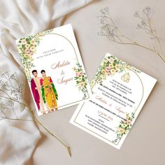 two wedding cards sitting on top of each other