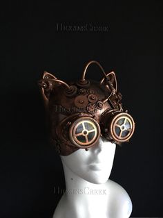 Crafted with meticulous detail, this women's masquerade mask fuses the whimsy of a cat with the intrigue of steampunk. Intricate gears and tubes create a mesmerizing spectacle, reflecting the steampunk aesthetic. The goggles detail adds mystery and adventure to your appearance. Leave everyone captivated by your feline presence at any Halloween party or cosplay event!


Age Group/Gender - Adult/Women

Size/Type - One size fits all adults

Mask Color - Copper

Mask Material - Polyresin

Accent Mat Steampunk Face Mask, Led Lights Party, Masquerade Mask Women, Festival Mask, Led Light Mask, Masquerade Ball Masks, Purple Led Lights, Scary Halloween Masks, Mask Light