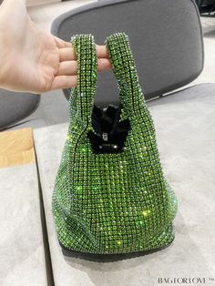 BagForLove - Glamorous Green Mini Evening Bag with Rhinestone Embellishments Product Description Color Green Details Rhinestone Magnetic Yes Strap Type Double Handle Bag Size Mini Style Glamorous Closure Type Magnet Pattern Type All Over Print Type Bucket Bag Material Artificial Crystal Care Instructions Do not wash Size Chart INCH CM Bag Height Bag Length Bag Width Handle Height Strap Length 6.7 inch 5.5 inch 5.5 inch 3.9 inch 43.3 inch Bag Height Bag Length Bag Width Handle Height Strap Length Glamorous Green Bags With Rhinestones, Embellished Green Evening Shoulder Bag, Green Embellished Evening Shoulder Bag, Glamorous Green Evening Bag, Glamorous Bedazzled Evening Bags, Glamorous Evening Bedazzled Bags, Glamorous Green Event Bag, Evening Bags With Rhinestone Fringe, Evening Bag With Rhinestone Fringe