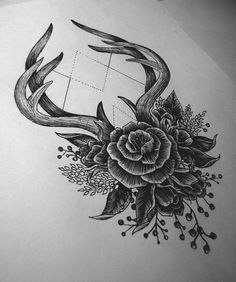 an antelope with flowers and leaves on it's back side tattoo design