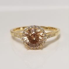 "Thanks for shopping our vintage estate store. We tend to sell well below wholesale and truly hope you enjoy all of our items. Many of the items are one of a kind, so please enjoy scrolling through the pictures and hopefully something will catch your eye. Brown spots from the camera or reflections. Estate 18k gold over sterling silver 925 copper honey 2ct champagne white CZ diamond princess ring.  Ring size: please select size Setting:  10mm 3/8\" CZ Diamond: 8mm center Band width: 2mm Weight: 3.38 grams Beautiful ring. No scratches on the stone. Marked 925." Classic Gold Topaz Ring With Accent Stones, Gold Topaz Ring With Halo Setting In 14k Gold, Vintage Gold Jewelry With Halo Design, Gold Topaz Ring With Halo Setting, Classic Round Topaz Jewelry, Heirloom Gold Topaz Ring With Center Stone, Classic Gold Topaz Ring Gift, Topaz Halo Setting Jewelry For Anniversary, Gold Topaz Ring With Cubic Zirconia Accent Stones