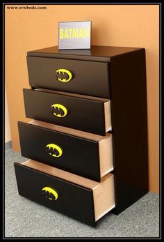 three drawers with batman decals on them